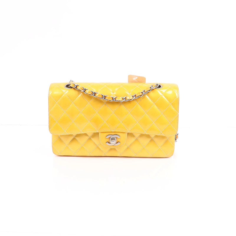 Front view of yellow CHANEL Timeless Classic Flap patent leather handbag